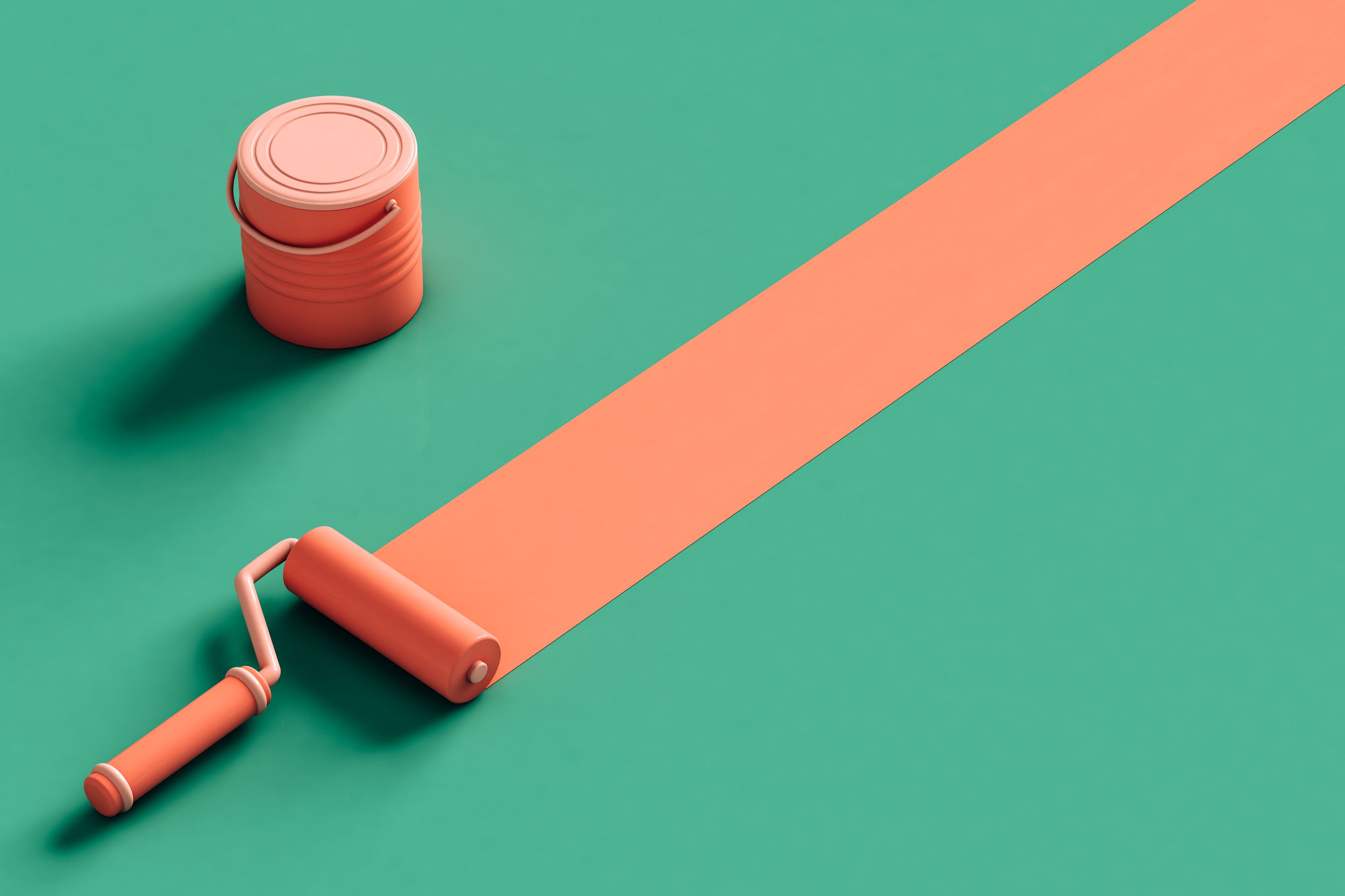 An orange paint bucket and paint brush on a green background. 
