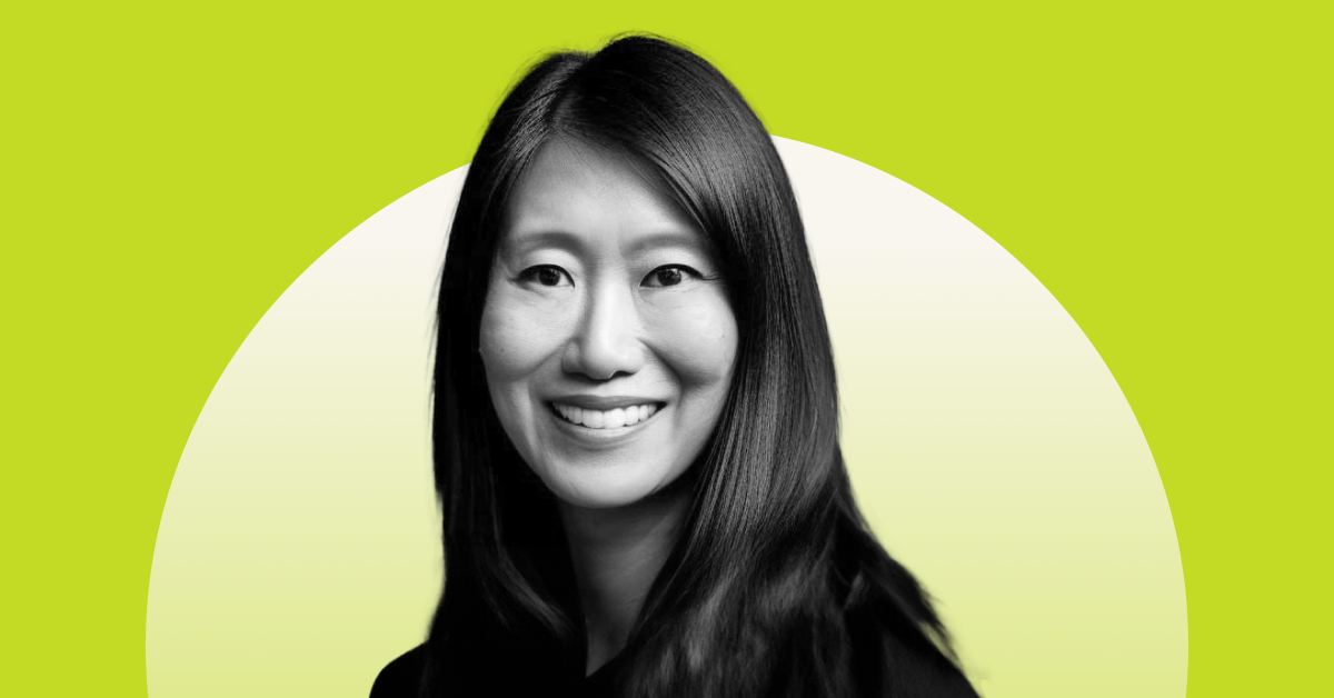 Headshot of Cathy Butler on a bright green background. 