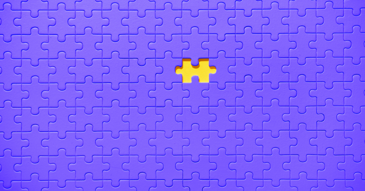 A purple puzzle with a missing yellow piece. 