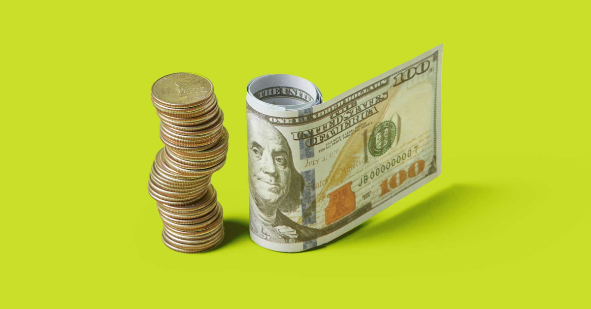 A stack of money beside a rolled up 100 dollar bill on a green background. 